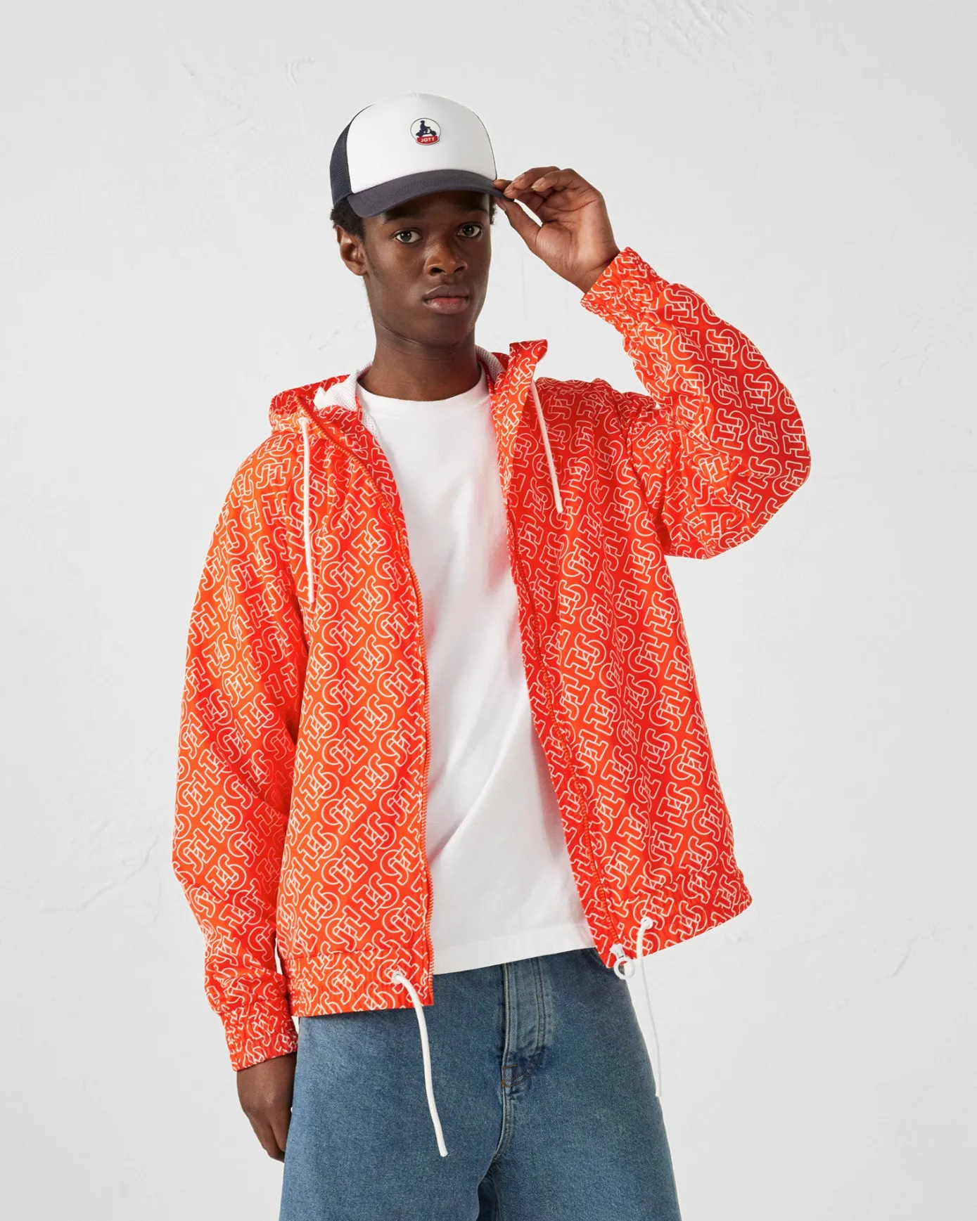 Blouson coupe-vent léger à capuche Mono rouge feu Storm monogram